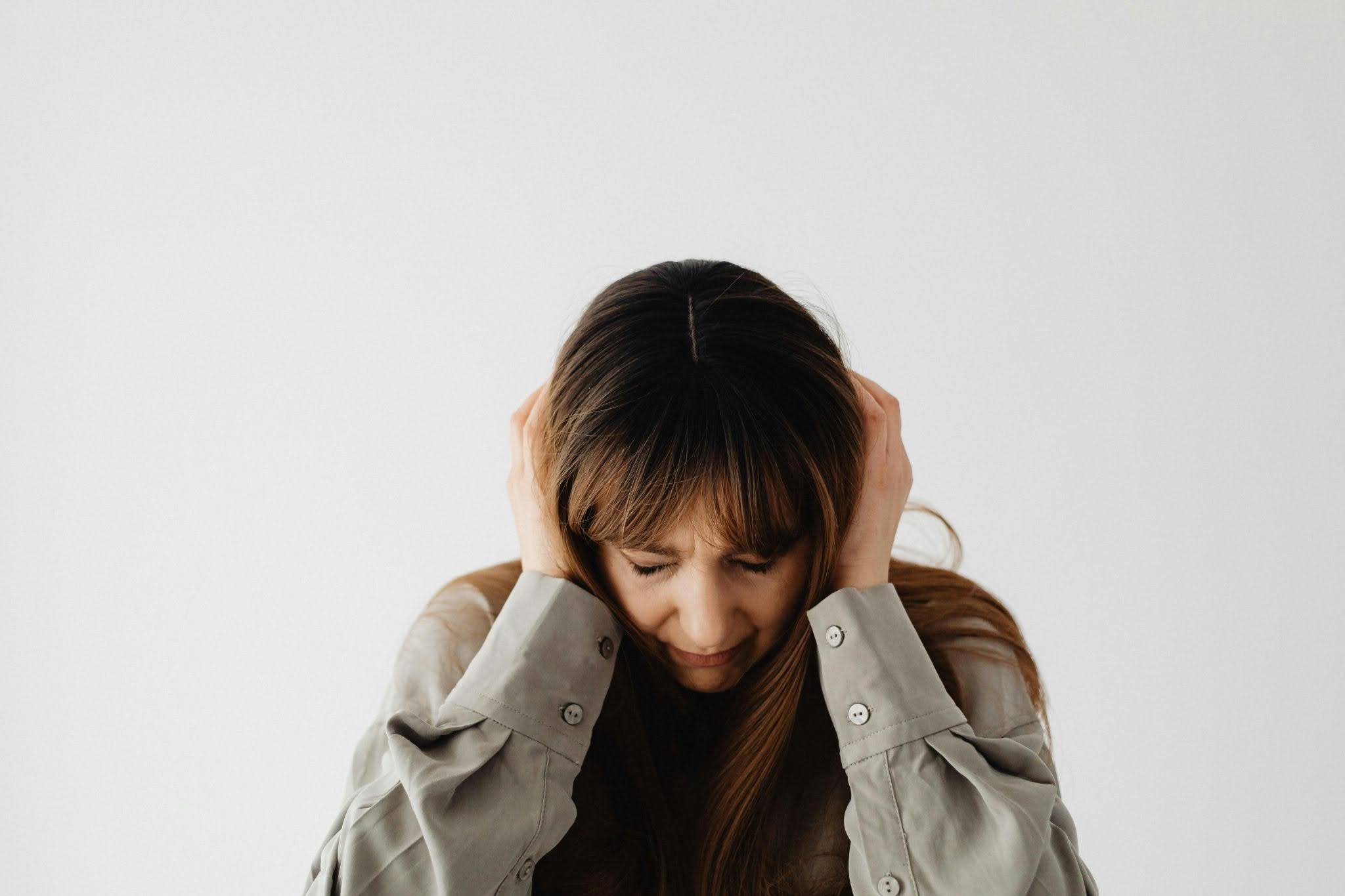 A neurodivergent adult experiencing sound sensitivity.