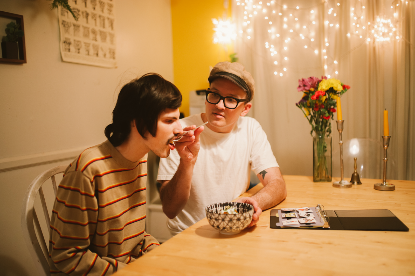 Parent giving food to neurodivergent son