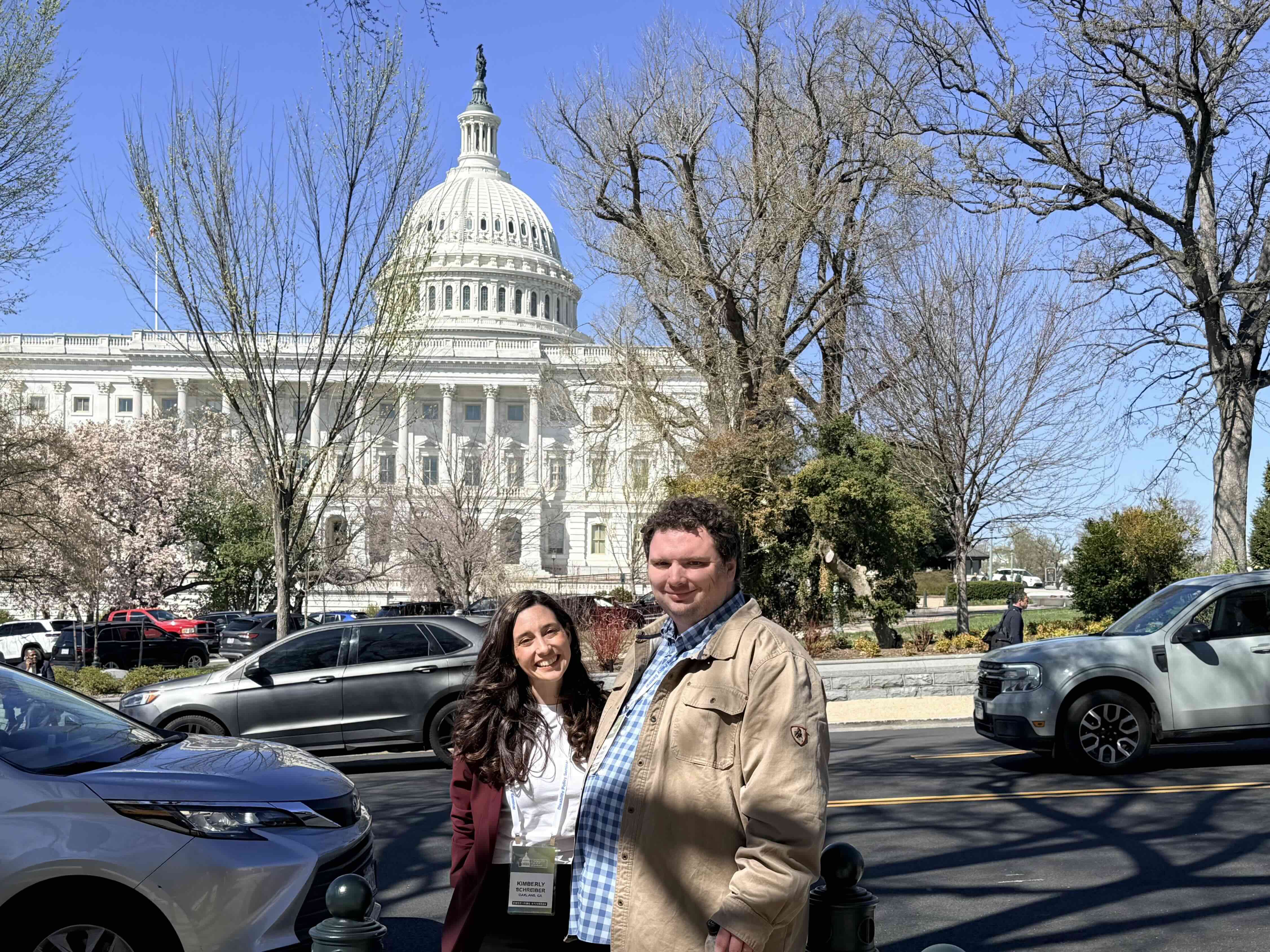 Kim Schreiber and her brother Stephen stand together in front of the U.S. Capitol.
