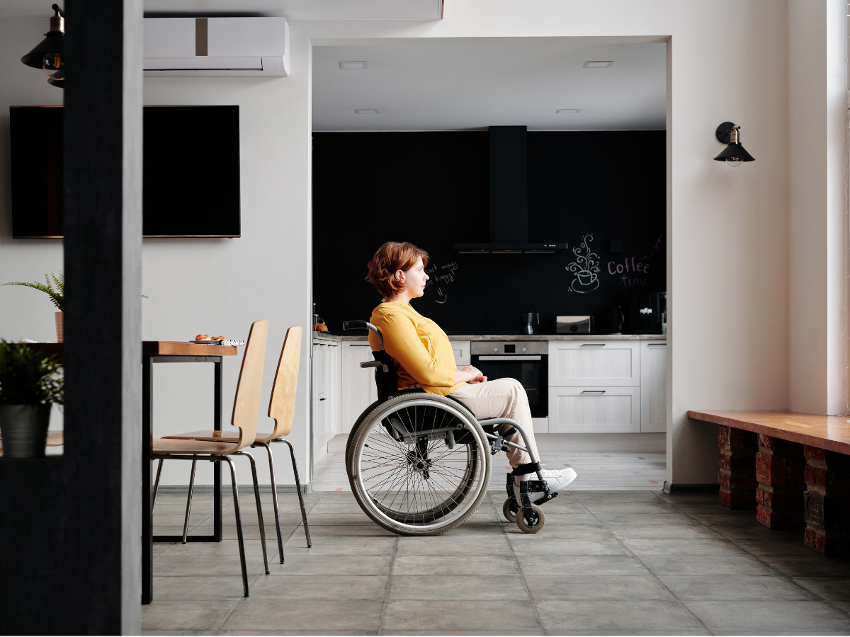 Women in a wheelchair looking out a window