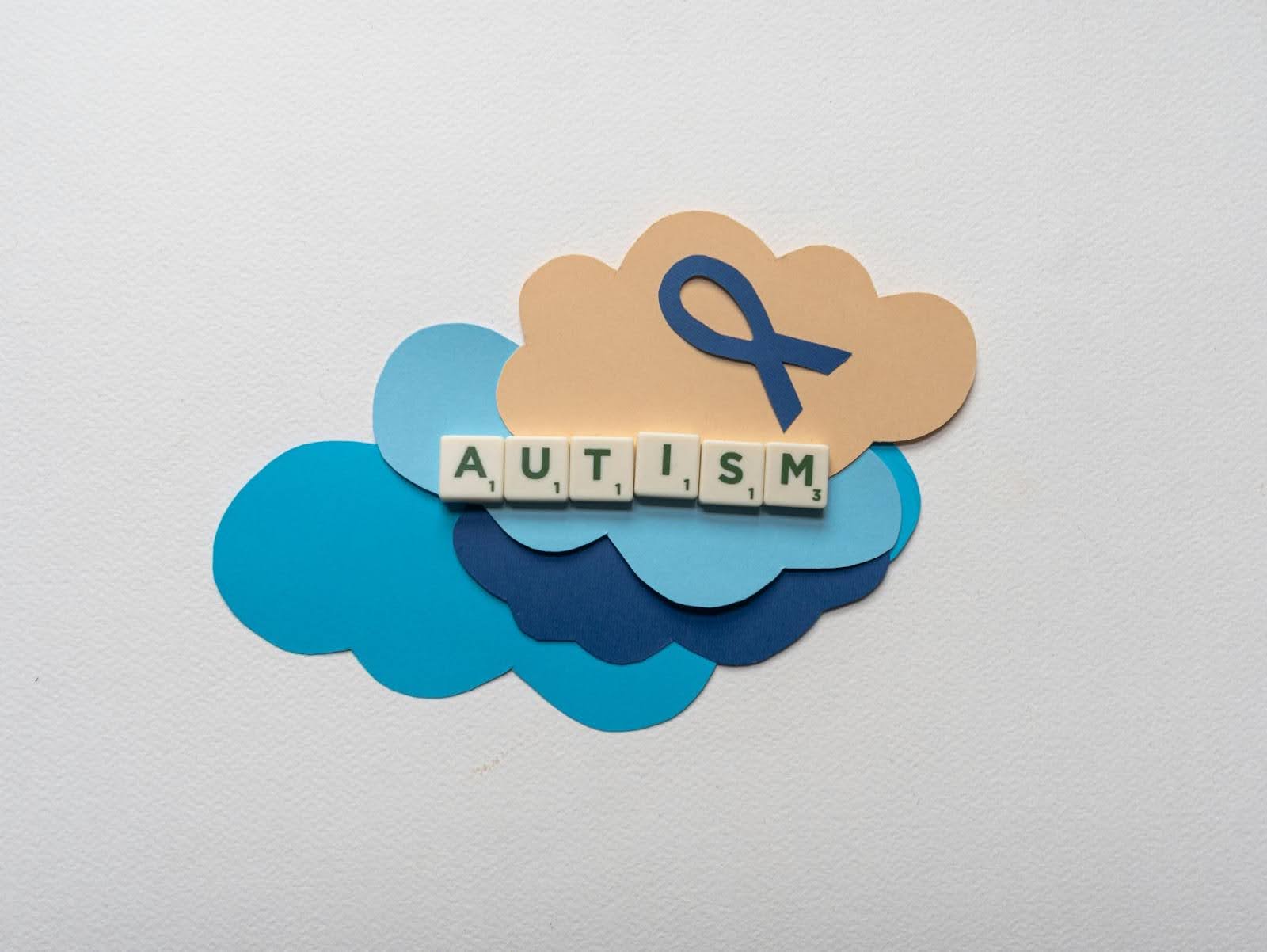 A design of clouds and the word "autism"