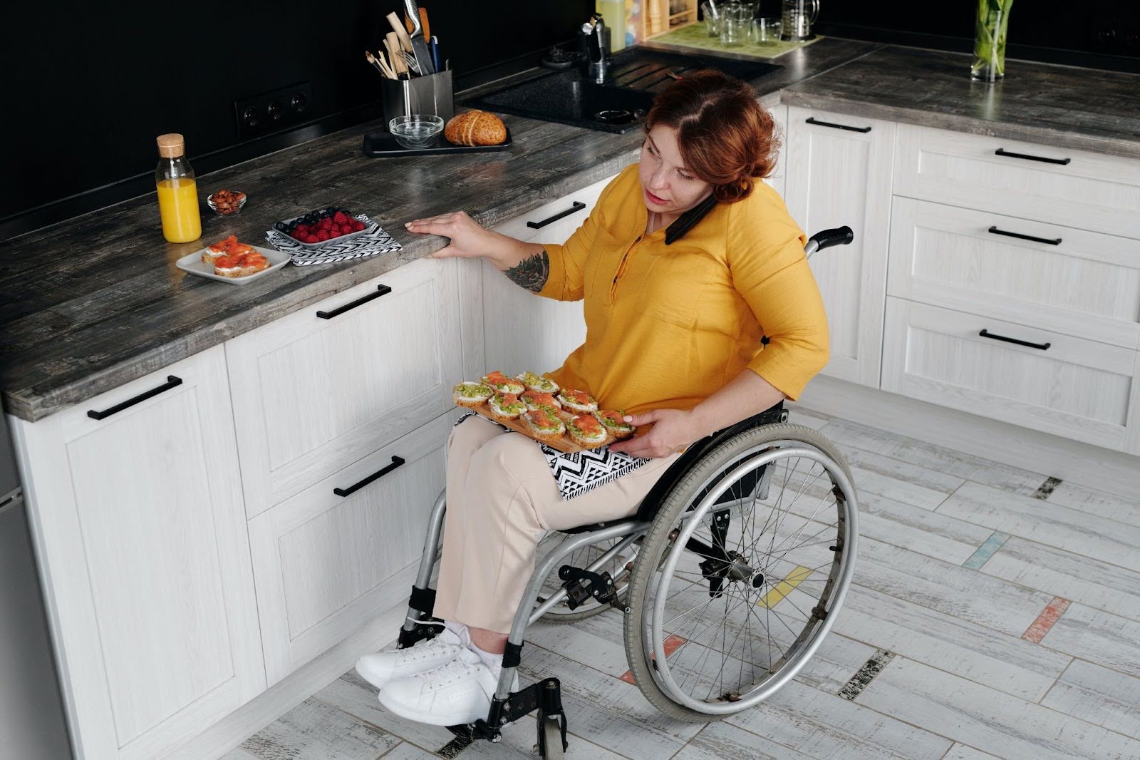 A woman in a wheelchair at home