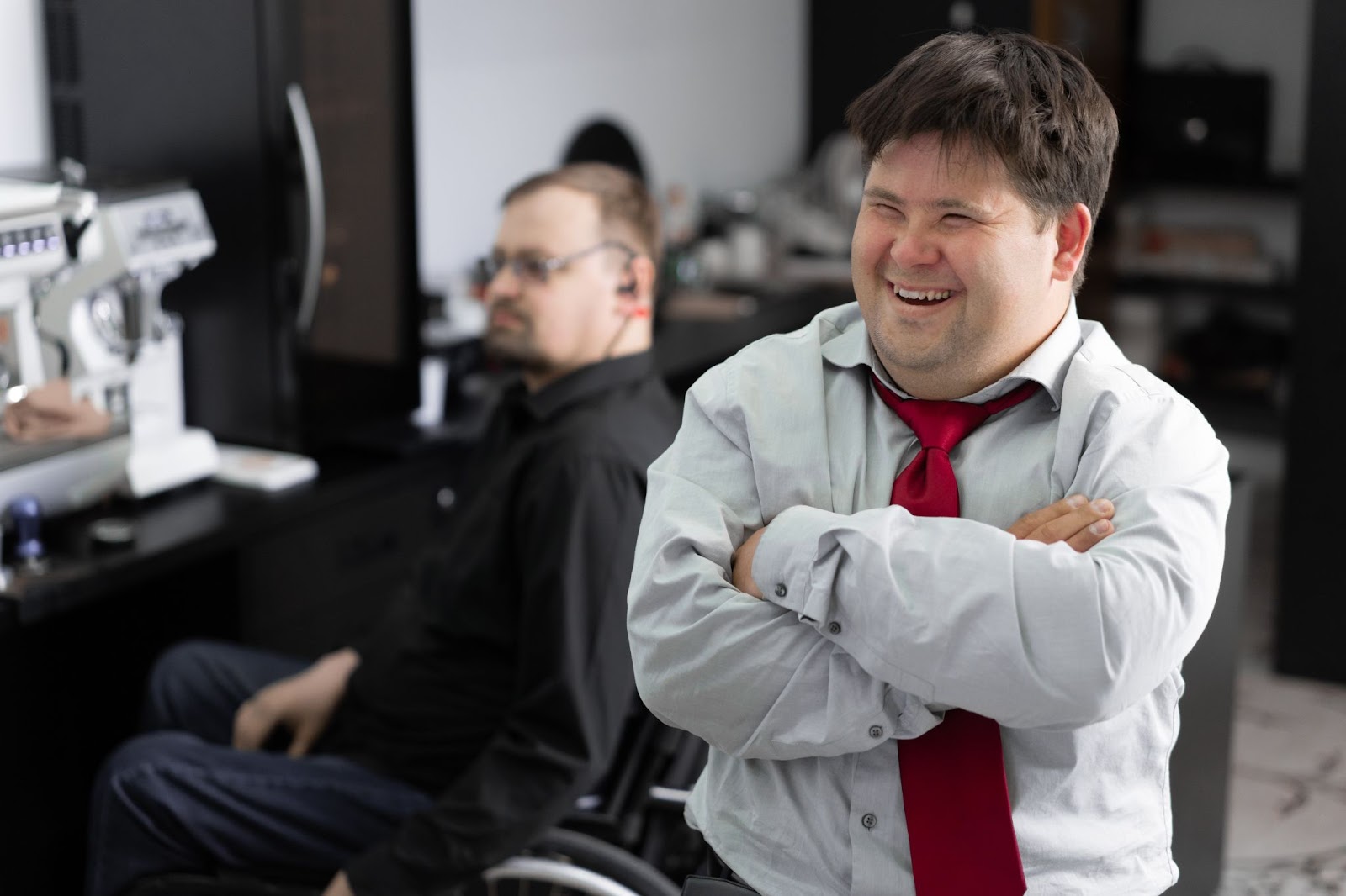 A man smiles and laughs